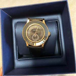 Women’s Swarovski rose gold watch with leather band